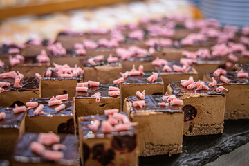 Different types of cakes on a buffet table. Selective focus.