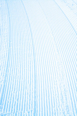 Stripes on snow surface profiled for future ski trace.
