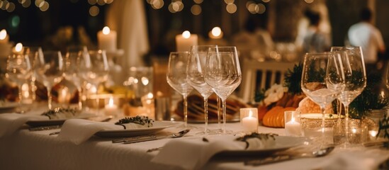 In the background of the festive party, a beautifully decorated table was set with an array of delectable food, accompanied by glasses of red wine to toast the celebration. The concept of the space