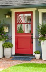 retro gray beach bungalow with bright red front door