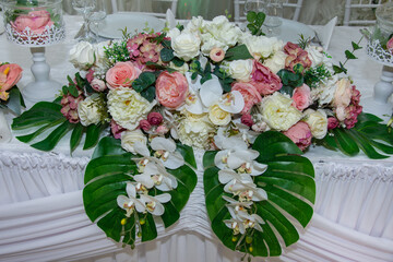the wedding table decorated with flowers in Romania