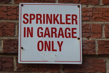 sprinkler in garage only sign
