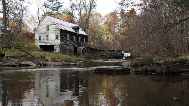 abandoned historic mill on stream (grain milling stone, water mill wheel) scenic rustic country building landmark (griding) rest plaus marbletown waterfall (still, pan up, down) footage