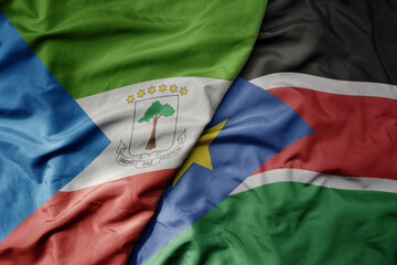 Obraz premium big waving national colorful flag of south sudan and national flag of equatorial guinea .