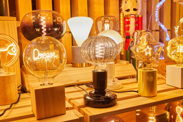 Various of lamp in showcase. Night light with inscription.