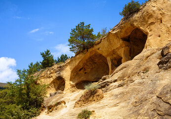 Mountain Ring near Kislovodsk, tourist attraction in Stavropol Krai, Russia. Landscape of sandy rock in summer, scenery of caves in stone wall and sky. Theme of nature, travel, hike