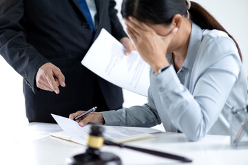 A legal officer is suffering from a headache as his boss scolds him