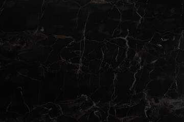 Black marble surface as background, closeup view