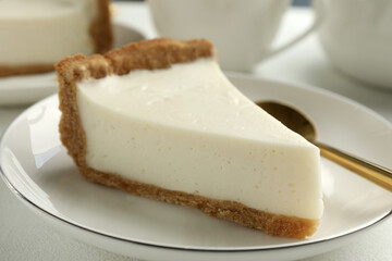 Piece of tasty vegan tofu cheesecake on table, closeup