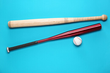 Baseball bats and ball on light blue background, flat lay - obrazy, fototapety, plakaty