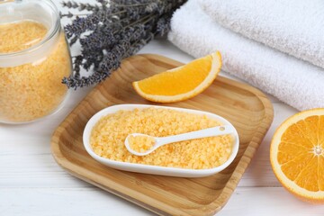 Sea salt, lavender, orange and towels on white wooden table