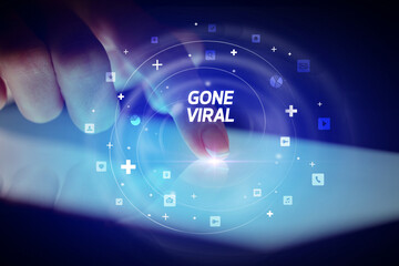 Finger touching tablet with social media icons concept
