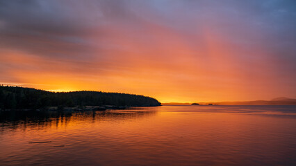 Beautiful sunset and rain in the distance from Salt Spring Island, British Columbia, Canada.
