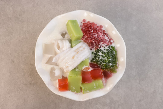 Buko Salad is Filipino Variation of Fruits Salad, it is Usually made from mixed  Sliced Young Coconut, Tapioca Pearl, Jelly, Nata de Coco with Sweetened Milk or Cream.