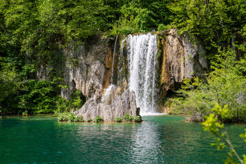 Fototapeta na wymiar Tranquil Oasis: A stunning view of waterfalls amidst lush greenery in Krka National Park, showcasing Croatia's natural beauty and tranquility. Perfect for travel and nature concepts.