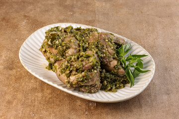 Ayam Tinoransak or Tinorangsak is a Type of Spicy Chicken Dish mixture of spices and Basil Leaves from Manado, North Sulawesi, Indonesia.