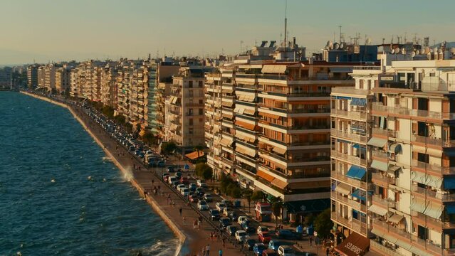Aerial panning view of the Nikis Avenue, aka Nikes Avenue, the central waterfront avenue and the famous sea port in Thessaloniki, Greece.