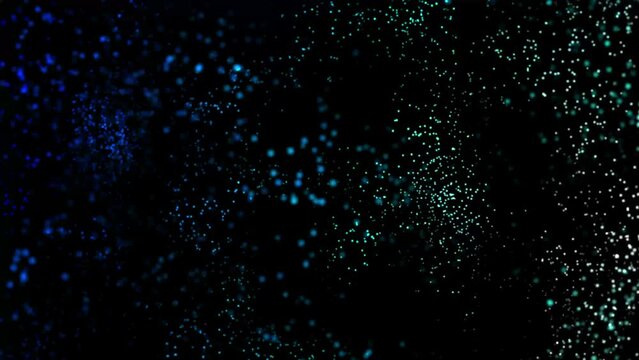 colored Particles Moving Background. fast energy flying wave line with flash lights. Particle from below. Particle color dust flickering on black background. Abstract Footage background for text.