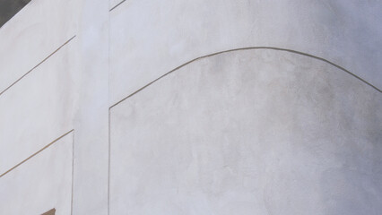 Background and texture of bare cement wall on the curve corner of external building wall with lines pattern on surface