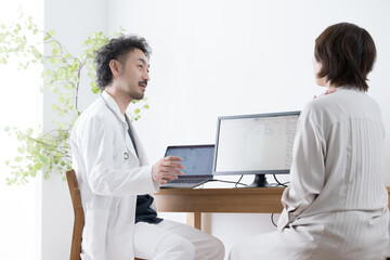 Doctor and patient examining a patient