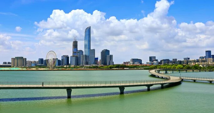 Suzhou skyline and modern buildings scenery by the lake, Jiangsu Province, China. Beautiful Jinji Lake landscape in Suzhou.
