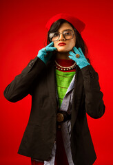 portrait of a woman wearing glasses in winter wearing coat and gloves 