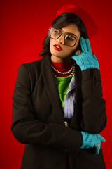 portrait of a woman wearing glasses in winter wearing coat and gloves 