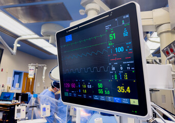 Hospital monitor displaying vital signs: heart rate, blood pressure, oxygenation, temperature, and end-tidal CO2, crucial for patient care and health assessment