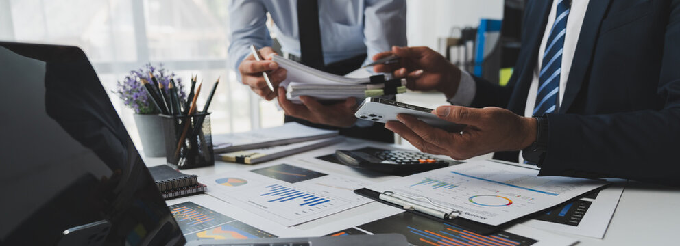 Asian male financial officer or accountant checking investment results Financial budget analysis Planning to summarize results and report to the meeting Audit concept and investment results.