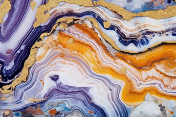 blue, purple and yellow marble and gold abstract background texture. Indigo ocean blue marbling with natural luxury style swirls of marble and gold powder.