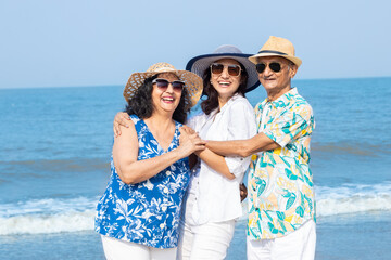 Portrait of happy senior indian family enjoying summer holidays vacations at beach, Retired senior...