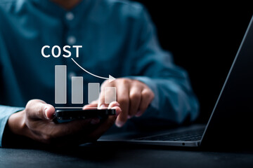 Cost reduction Concept. Businessman use smartphone with graph with down arrow icon for budget management and cost management.