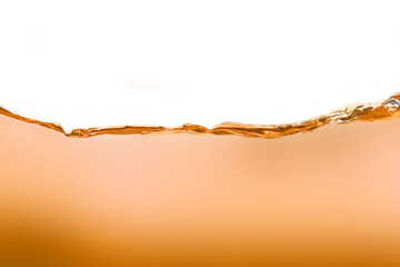 The surface of the orange water ripples looks like beer.	