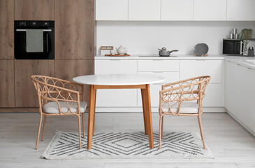 Interior of modern kitchen with clean dining table