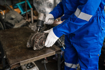Closeup of auto mechanic are using the wrench to repair and maintenance auto engine is problems at car repair shop.