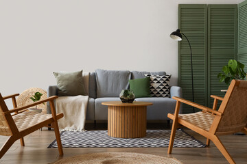 Interior of modern living room with grey sofa, armchairs and coffee table