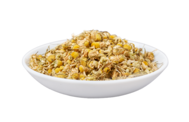 dry chamomile or camomile flower leaves isolated in white bowl background. pile of dry chamomile or camomile flower leaves isolated. heap of dry chamomile or camomile flower leaves for healthy tea 