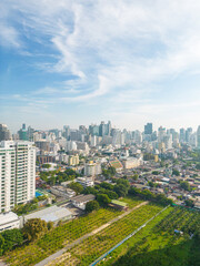 Obraz premium Aerial view of Lumphini Park backgrounded by the Silom area skyline office building business district