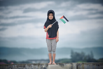 Cute Little girl waving Palestine Flag sends a powerful message of support and empathy to the world 
