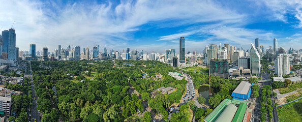Aerial view of Lumphini Park backgrounded by the Silom area skyline office building business district