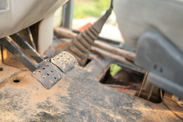 Close-up at break pedal step of a factory forklift. Industrial vehicle object part photo. Selective...