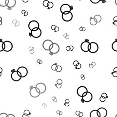 Fototapeta na wymiar Seamless vector pattern with wedding rings symbols, creating a creative monochrome background with rotated elements. Vector illustration on white background