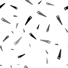 Seamless vector pattern with hand saw symbols, creating a creative monochrome background with rotated elements. Illustration on transparent background