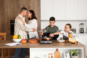 Happy family cooking in kitchen