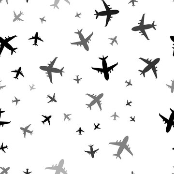 Seamless vector pattern with airplane symbols, creating a creative monochrome background with rotated elements. Illustration on transparent background