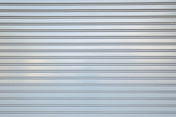 Aluminium or metal material wall of the vehicle garage rolled gate during it closed. Background and...