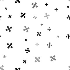 Seamless vector pattern with division symbols, creating a creative monochrome background with rotated elements. Illustration on transparent background