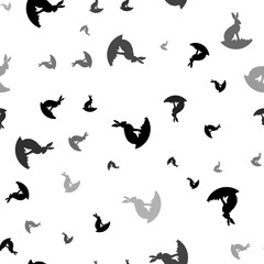 Seamless vector pattern with hare symbols, creating a creative monochrome background with rotated elements. Illustration on transparent background