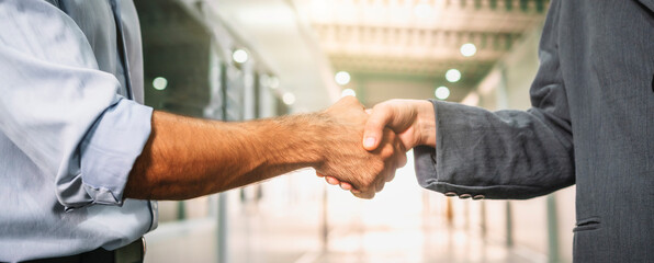 Businessmen shake hands and agree to do business together