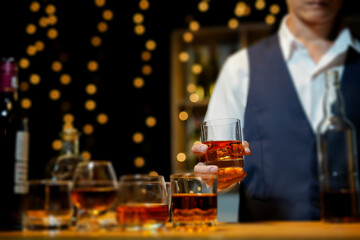 Bartender Serve Whiskey, on wood bar, 